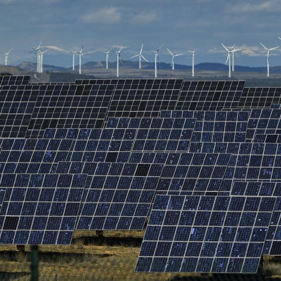 Solar panels work near the small town of Milagro, Navarra Province, northern Spain, Feb. 24, 2023. (AP Photo/Alvaro Barrientos)