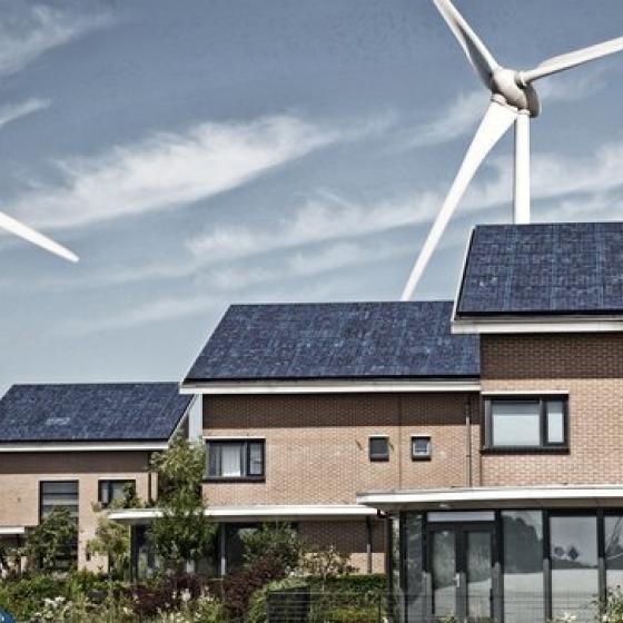 wind turbines behind houses