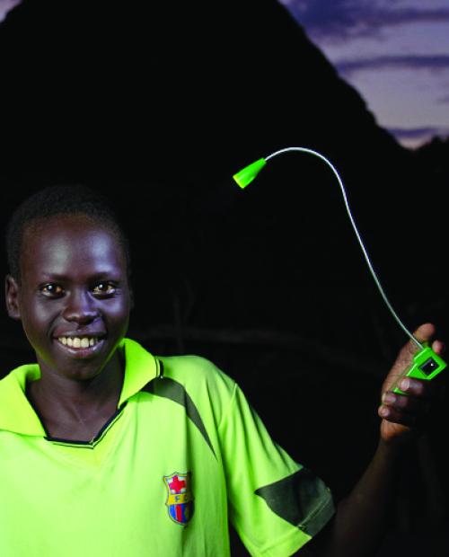 kid holding a light